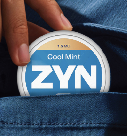 Image of a ZYN Cool Mint nicotine pouch can in a shirt pocket